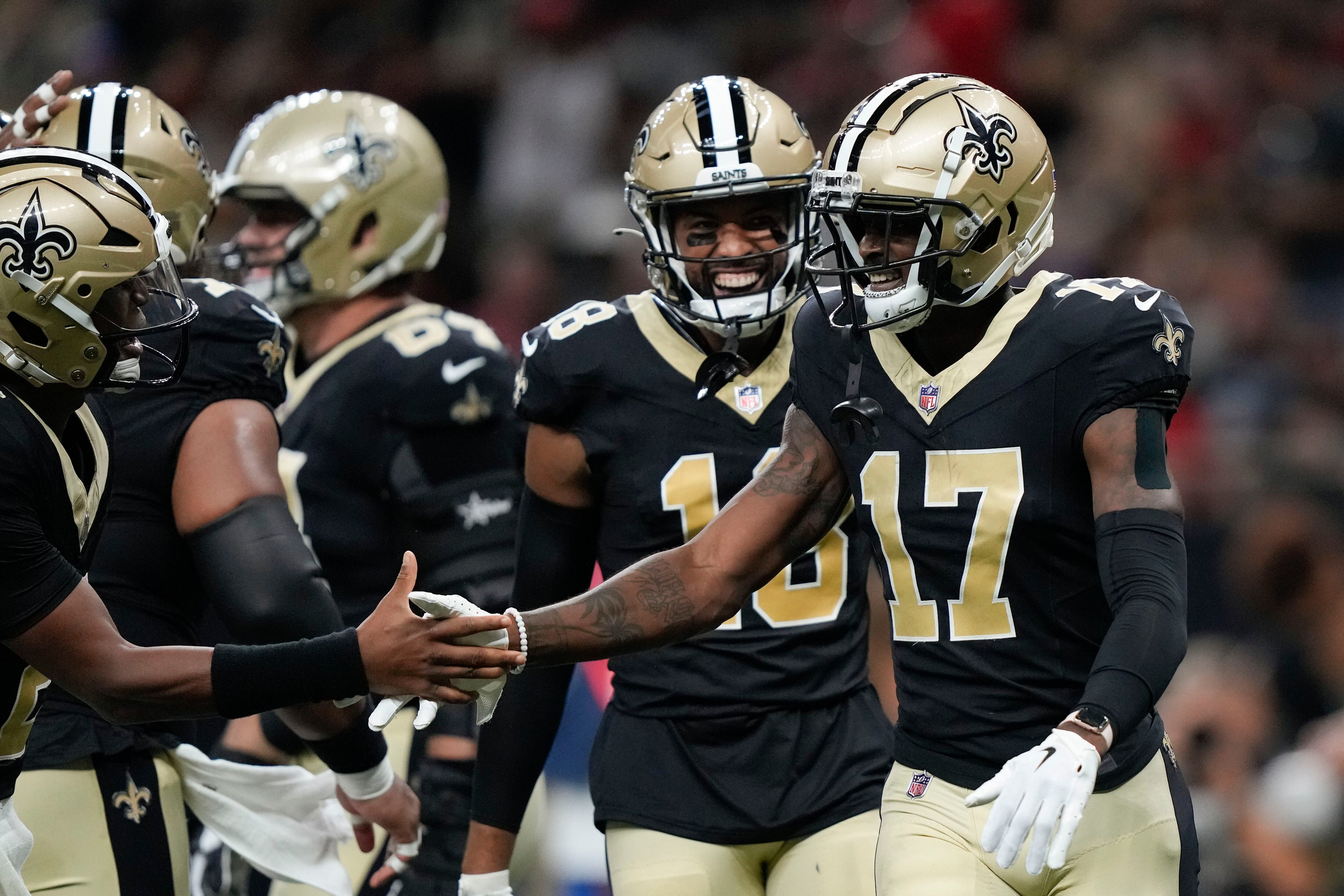 Jake Haener of the New Orleans Saints throws a pass during the