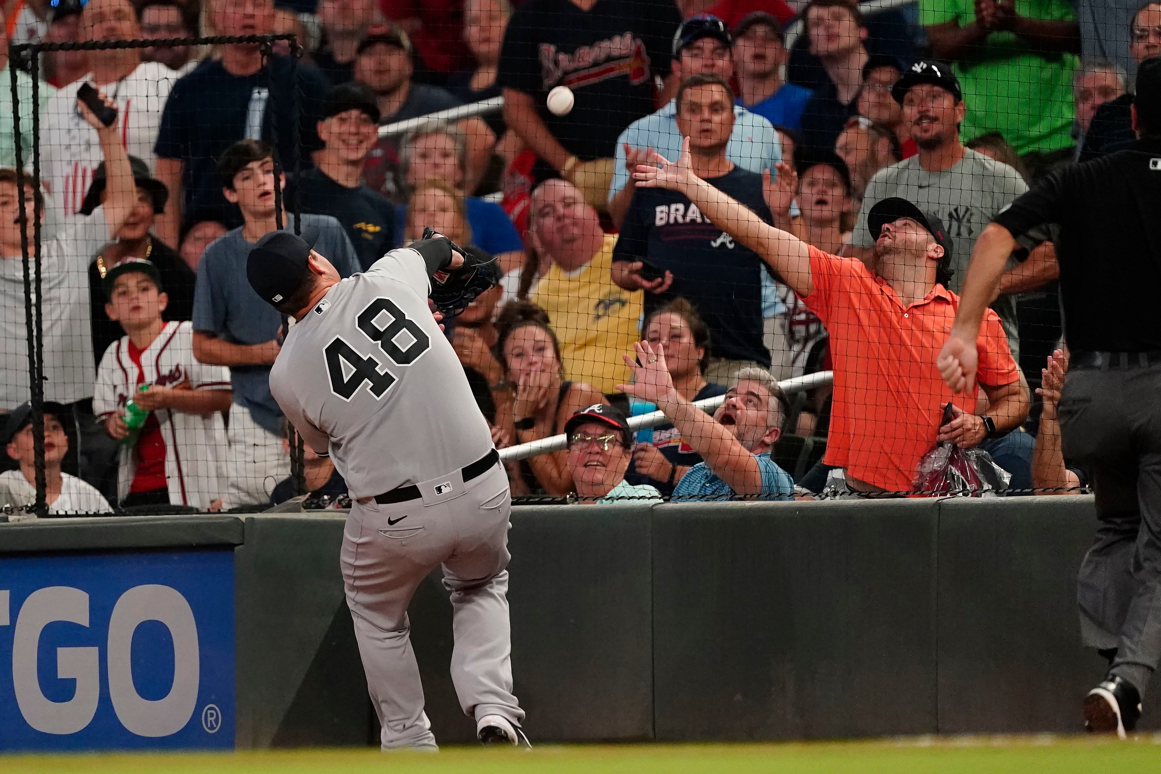 Yankees hit 3 HRs, hold off Braves 5-4 for 11th straight win