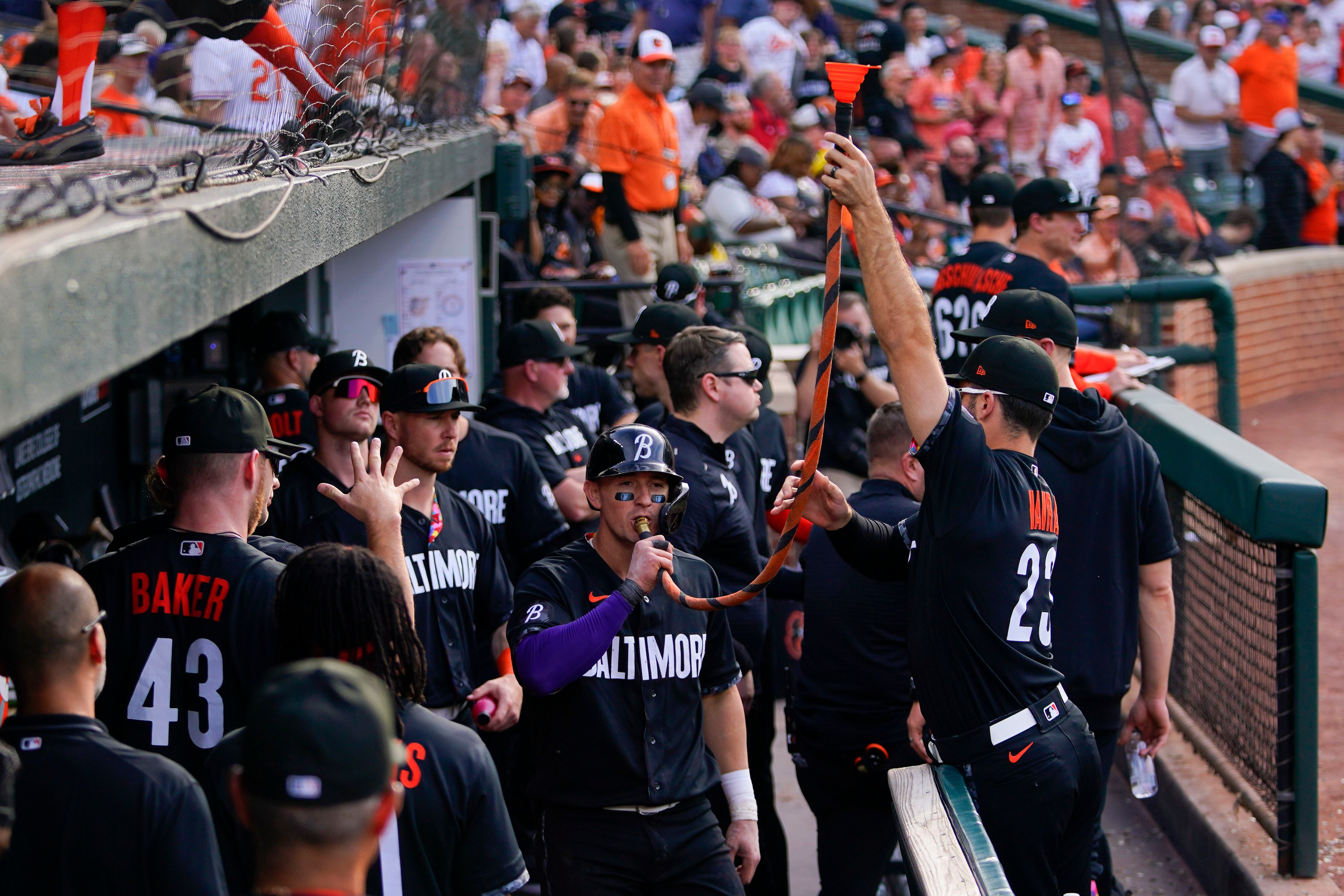 Mr. Splash sprays fans in the Bird Bath Splash Zone during the fifth  inning of a baseball game between the Baltimore Orioles and the Texas  Rangers, Friday, May 26, 2023, in Baltimore.