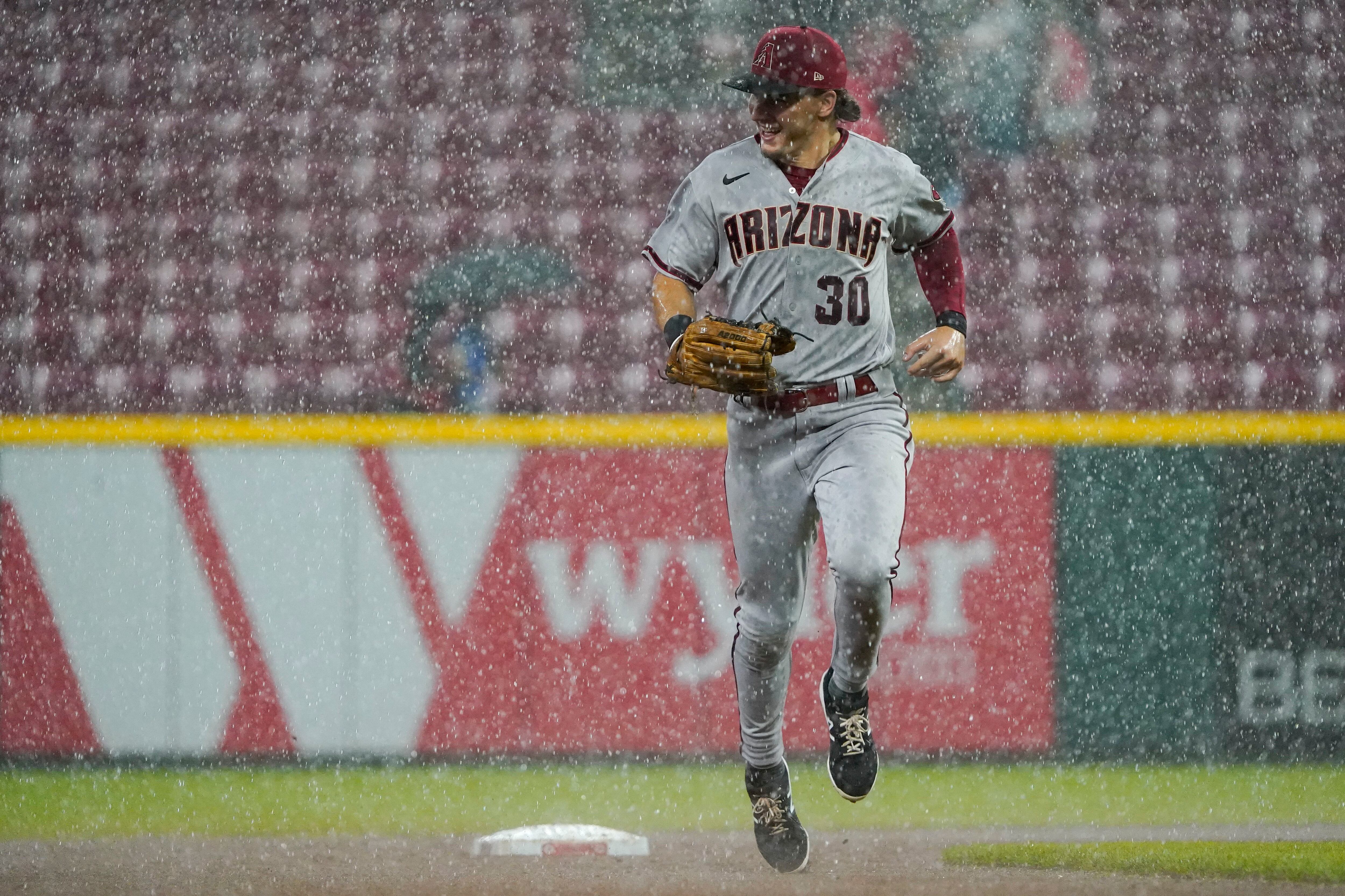 Greene retires 20 straight in rain-shortened win for Reds