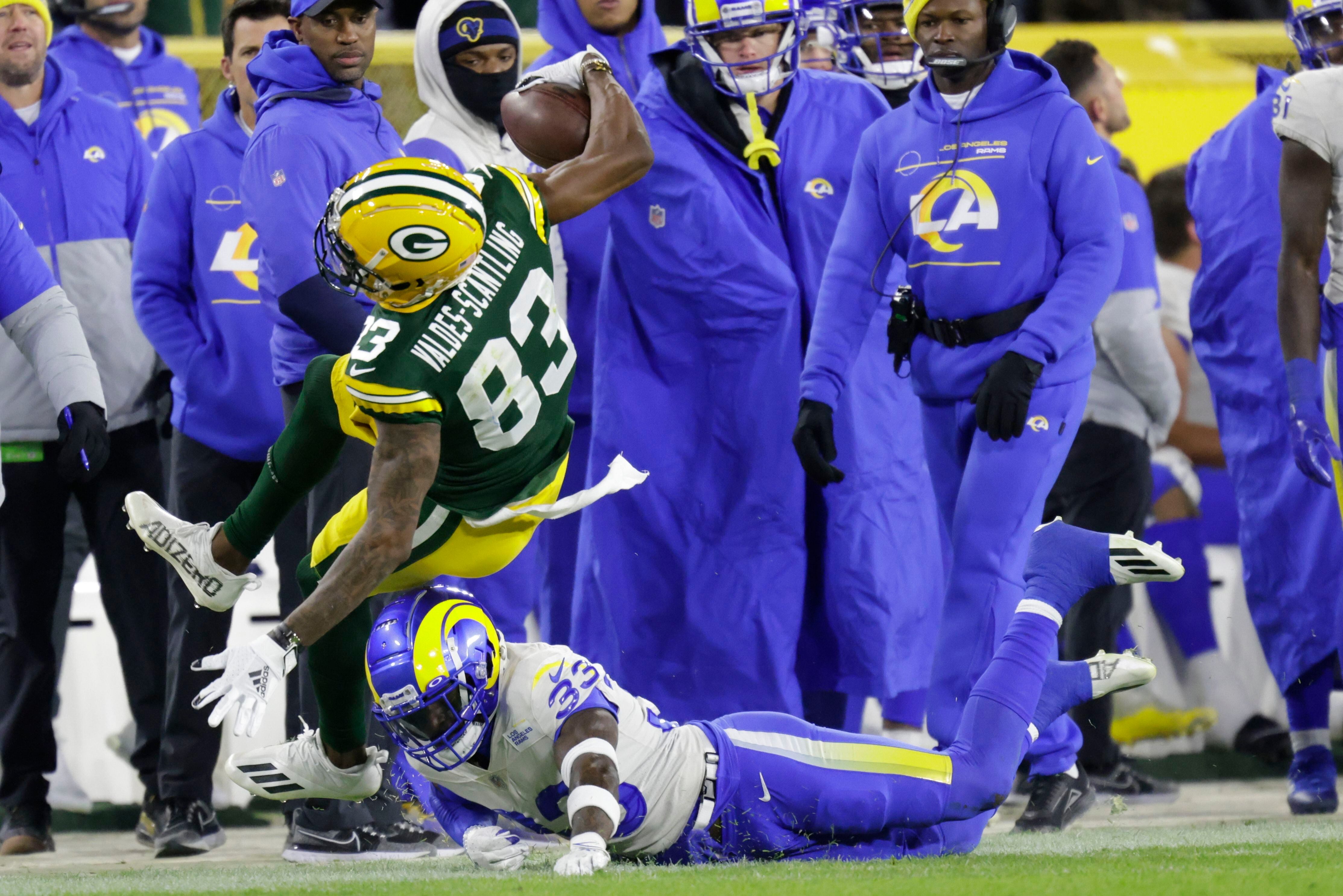 Toe injury can't stop Rodgers as Packers defeat Rams 36-28