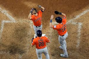 Fan at Astros watch party react to Jose Altuve's 3-run home run 