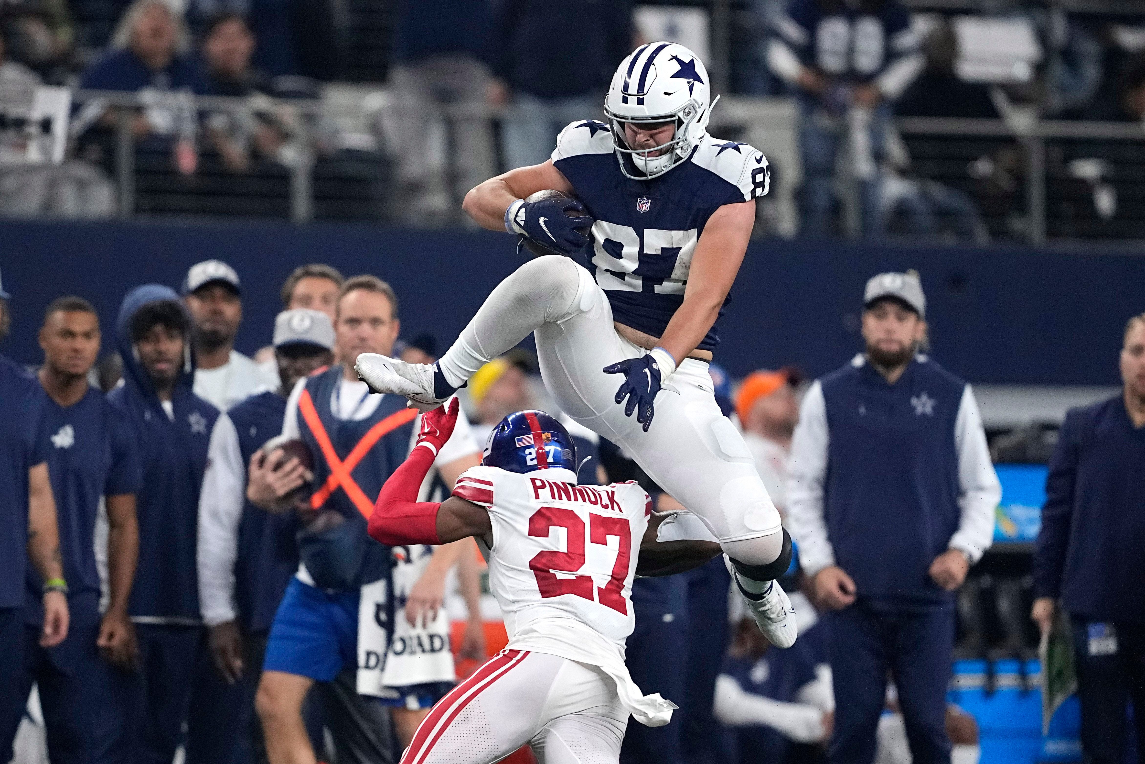 Watch: Cowboys TEs jump in Salvation Army kettle for 'Whac-A-Mole