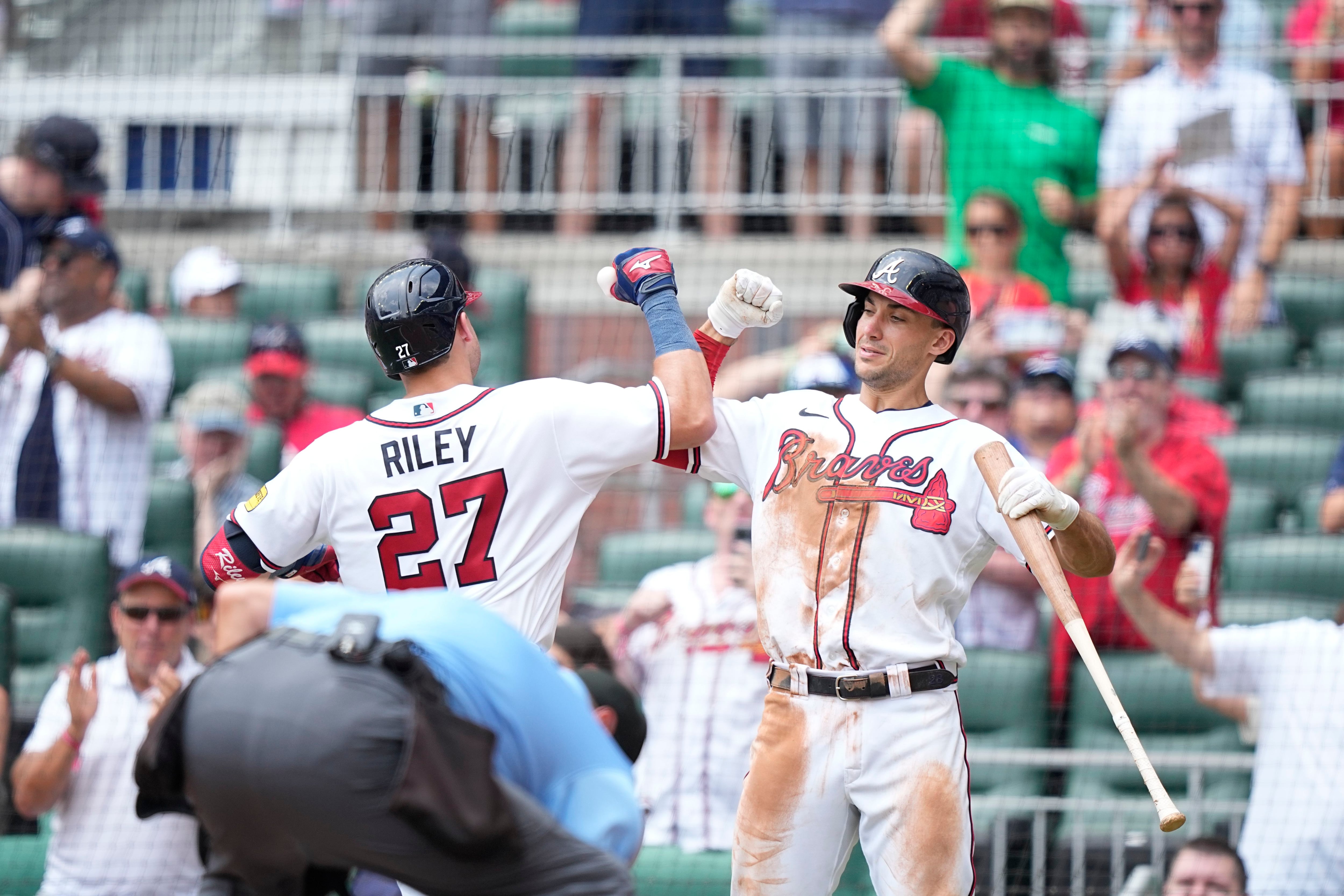 Austin Riley of the Atlanta Braves celebrates with teammates after