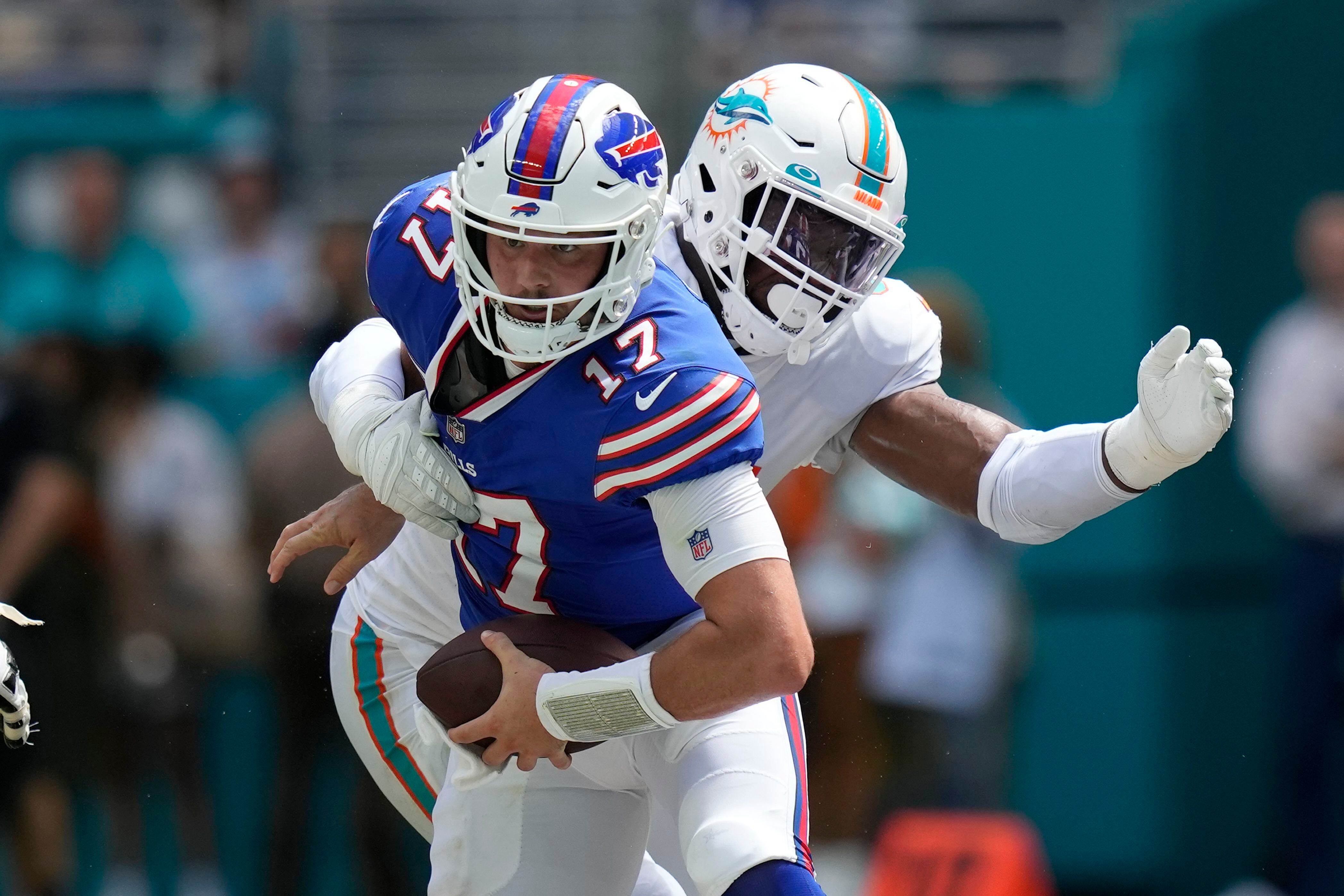 Sunday's NFL: Dolphins halt Allen, survive 'butt punt' to beat Bills