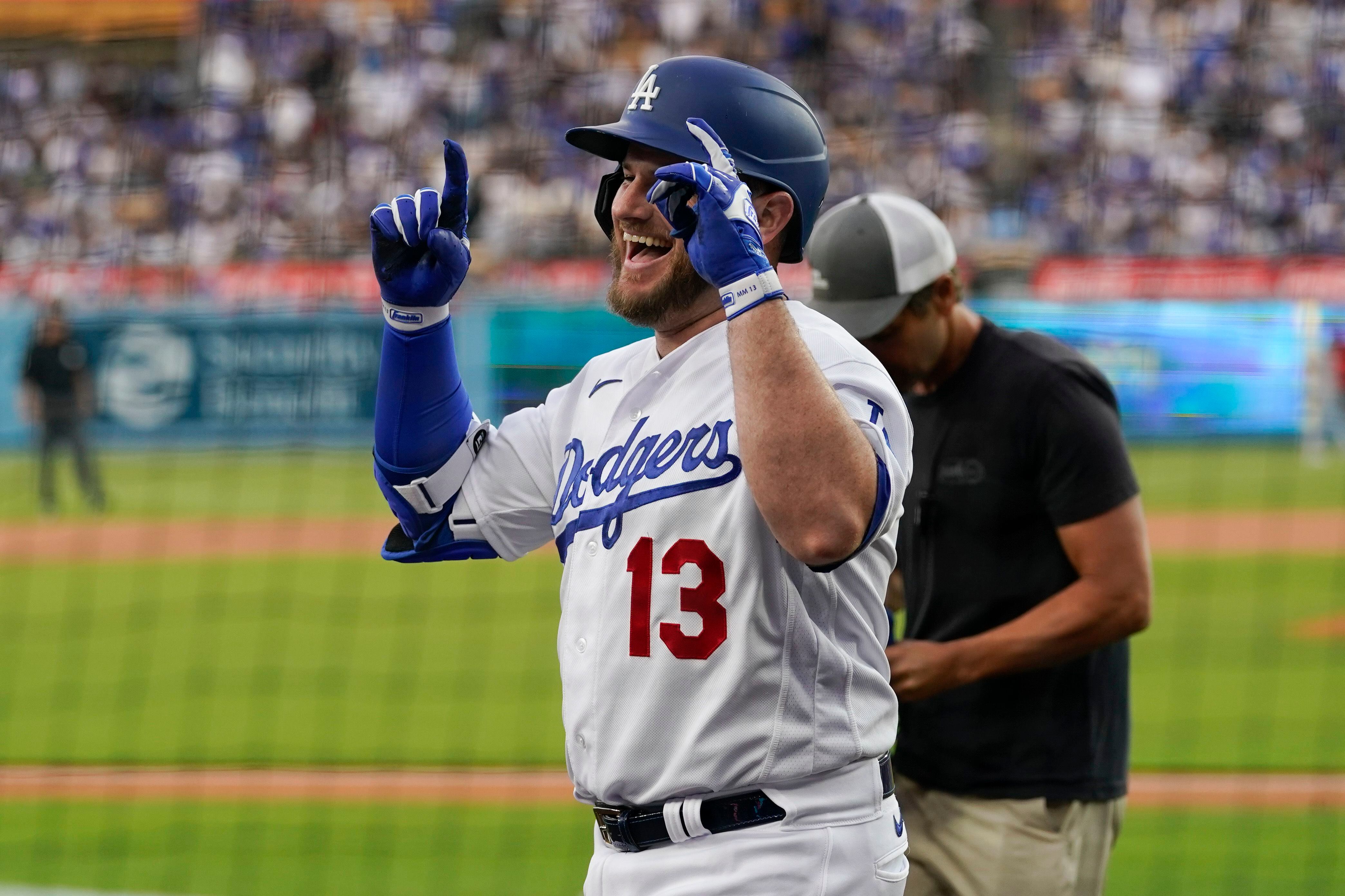 Kynlee Betts, center, greets her father, Los Angeles Dodgers right