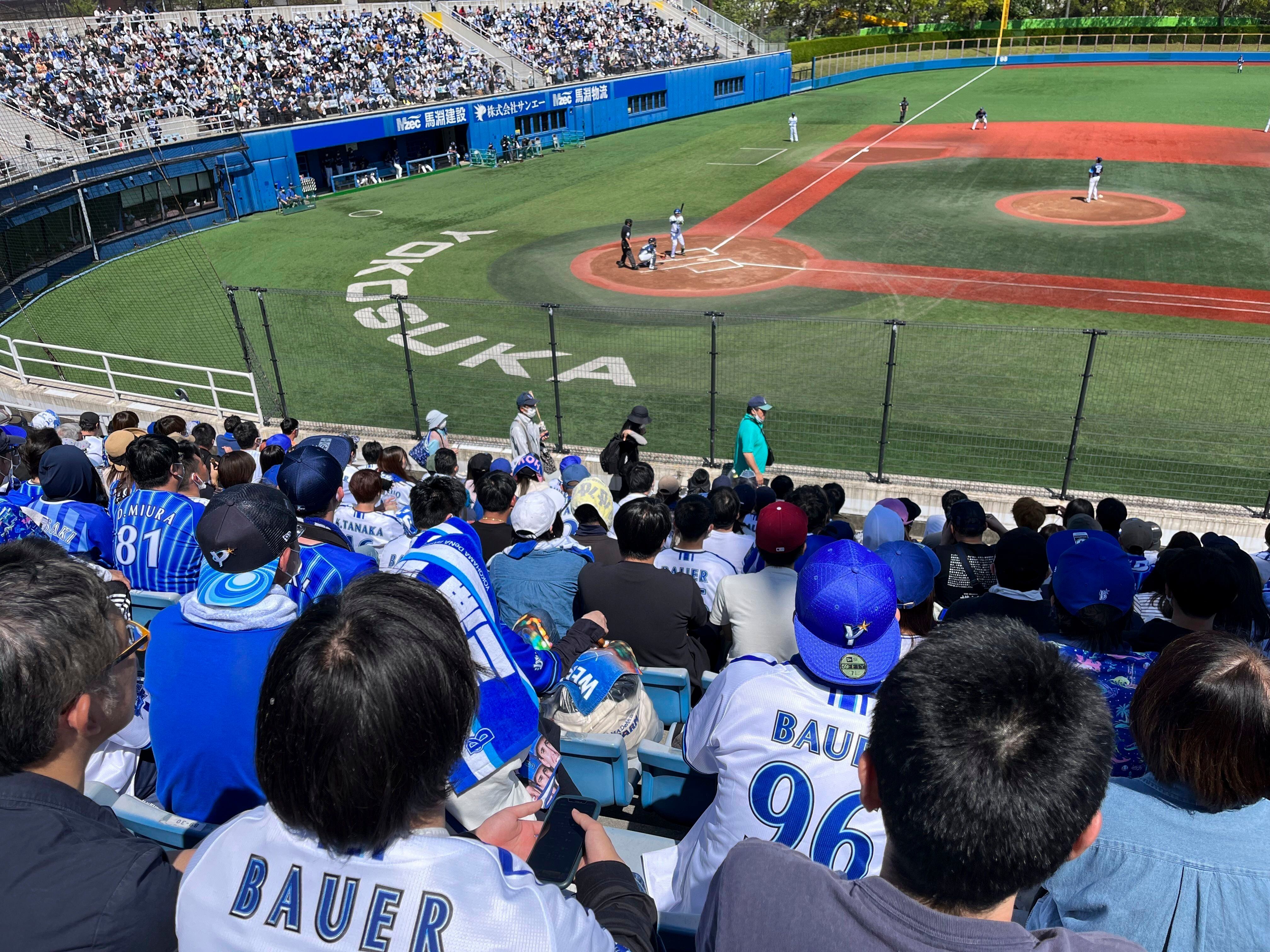 Trevor Bauer with his new uniform and cap of Yokohama DeNA BayStars poses  for photographers during a photo session of the news conference Friday,  March 24, 2023, in Yokohama, near Tokyo. (AP