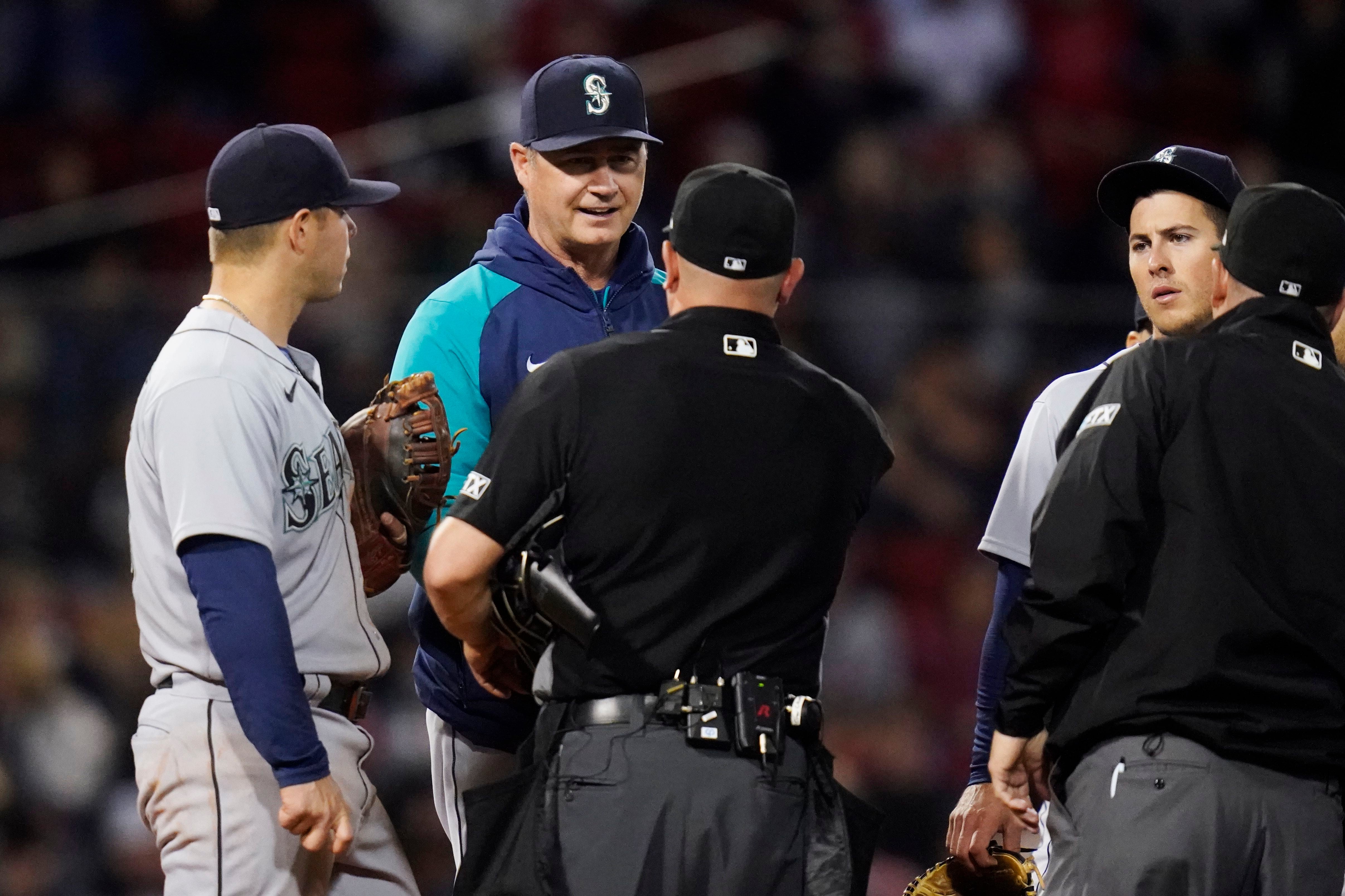 Mariners score seven runs on three hits to beat Red Sox in 10