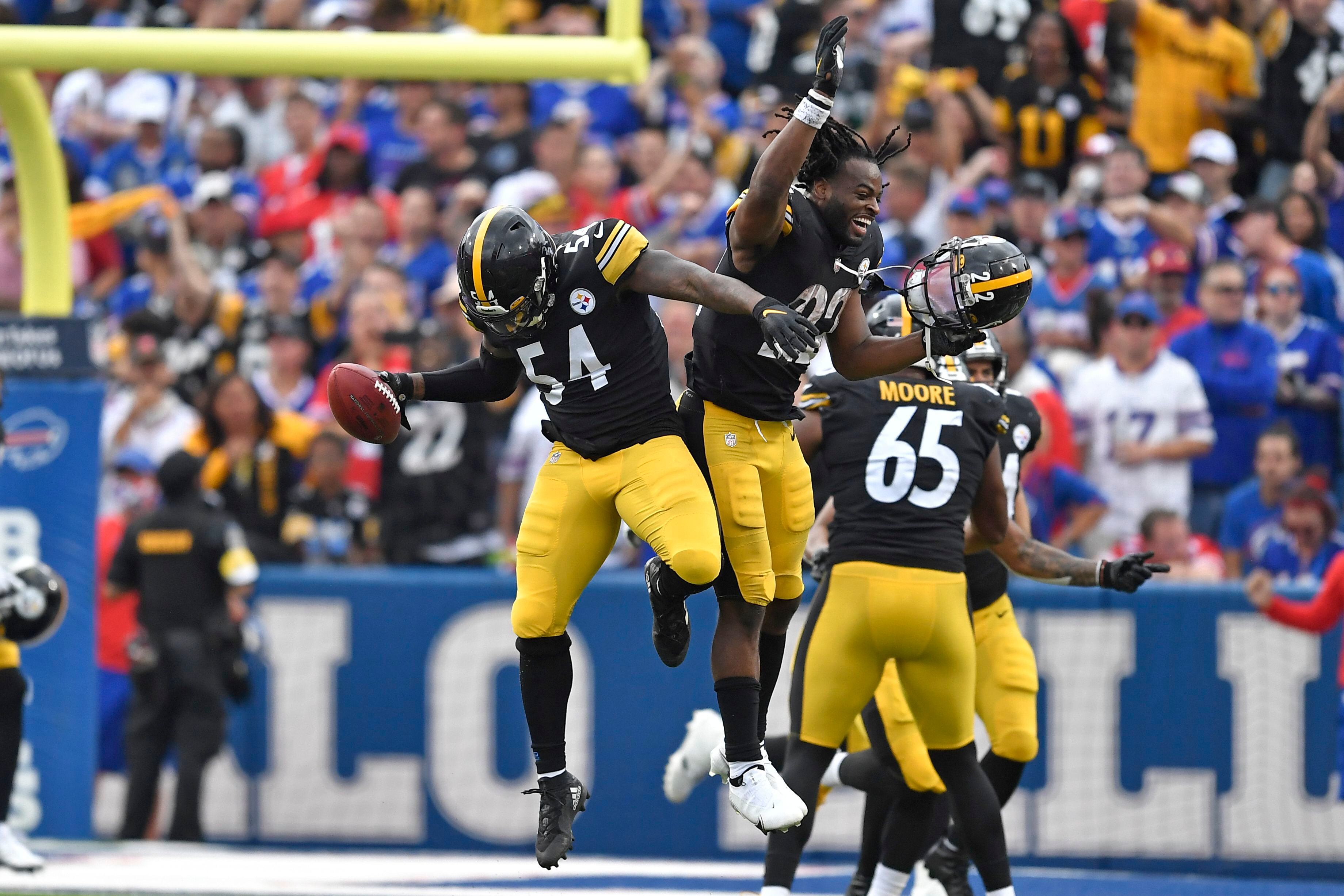 Pittsburgh Steelers cornerback Cameron Sutton, right, is hit by Los Angeles  Chargers offensive …