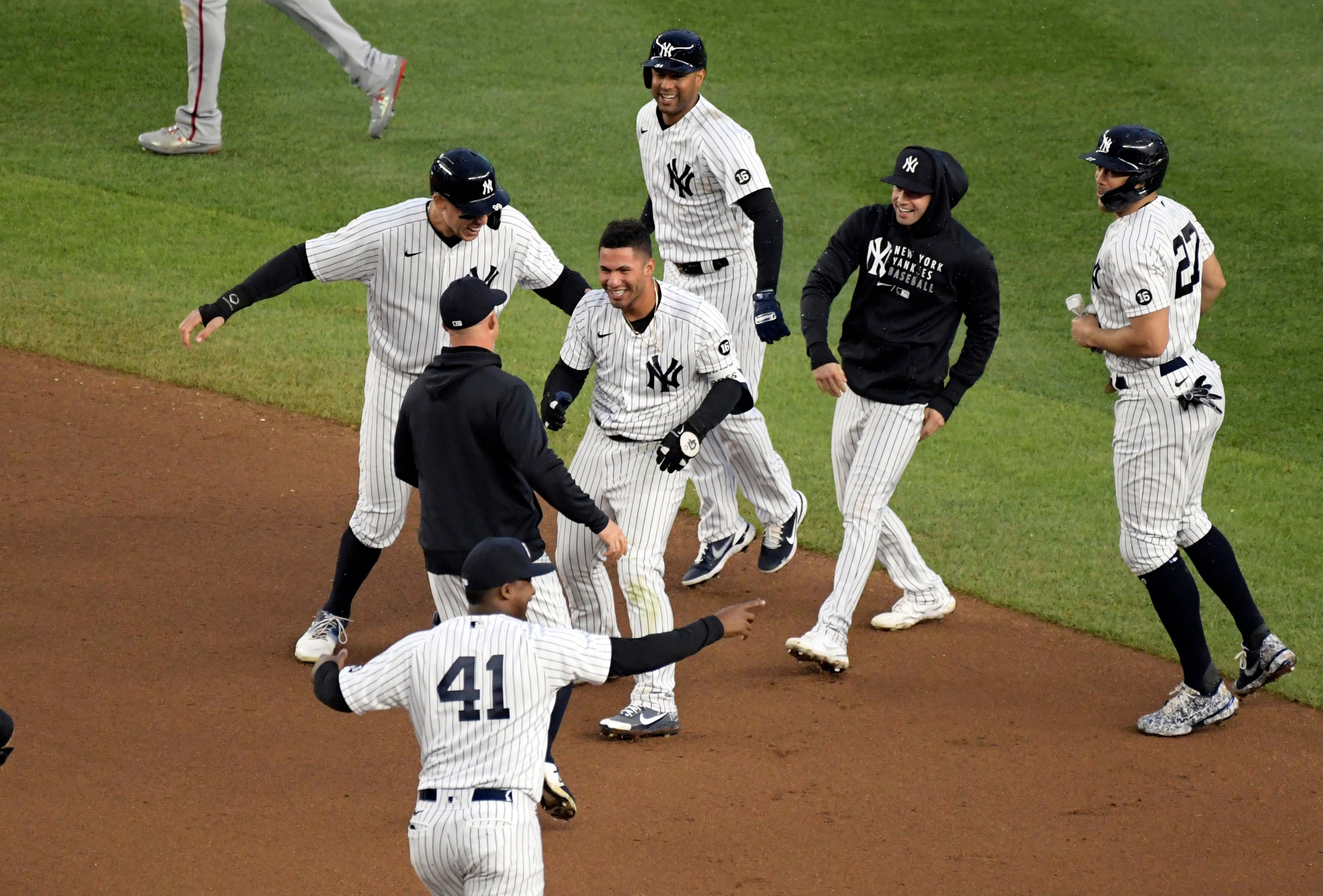 New York Yankees' Gleyber Torres (25) is congratulated by Josh