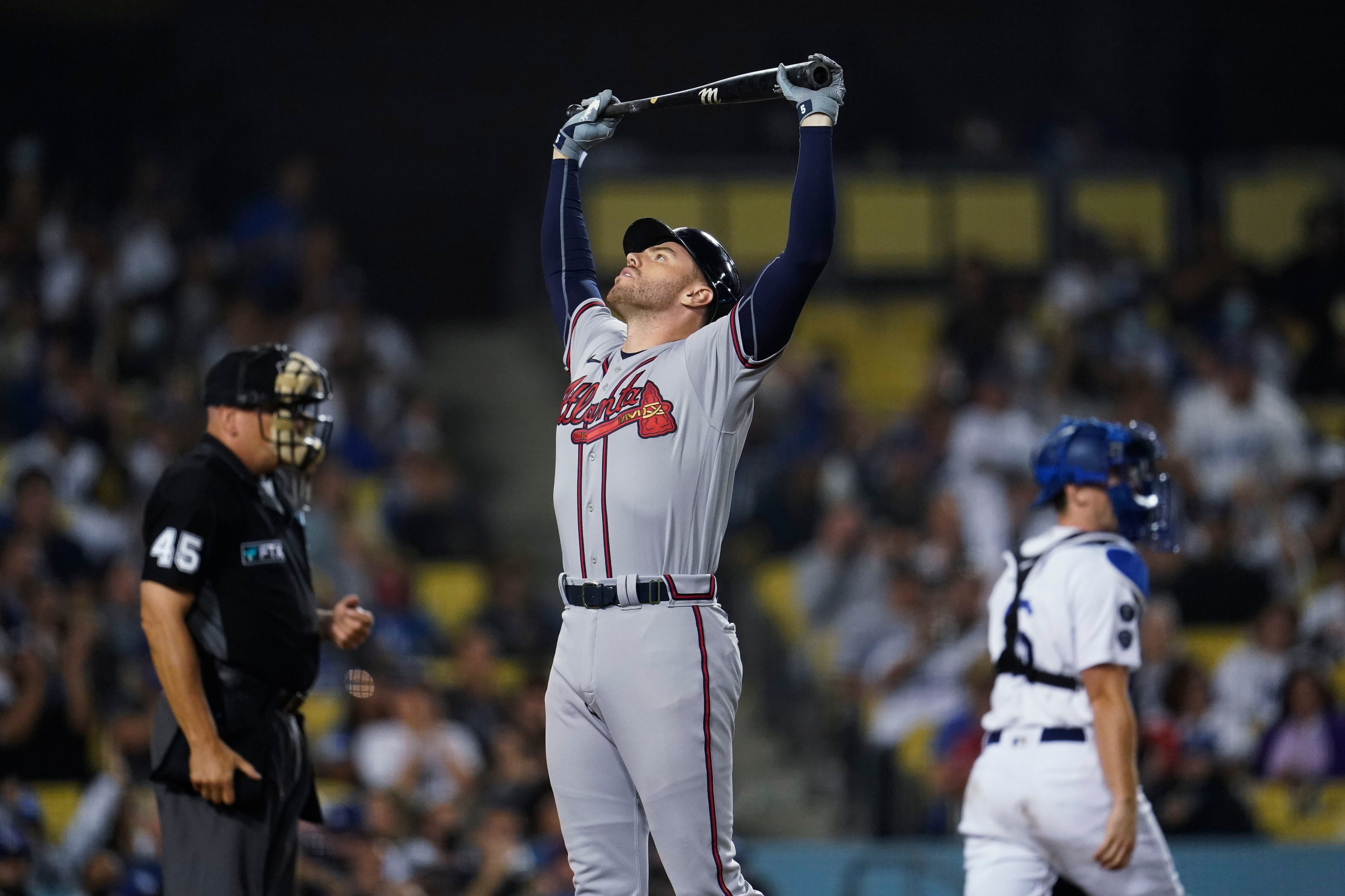 Braves star Albies carried away after fouling ball off knee