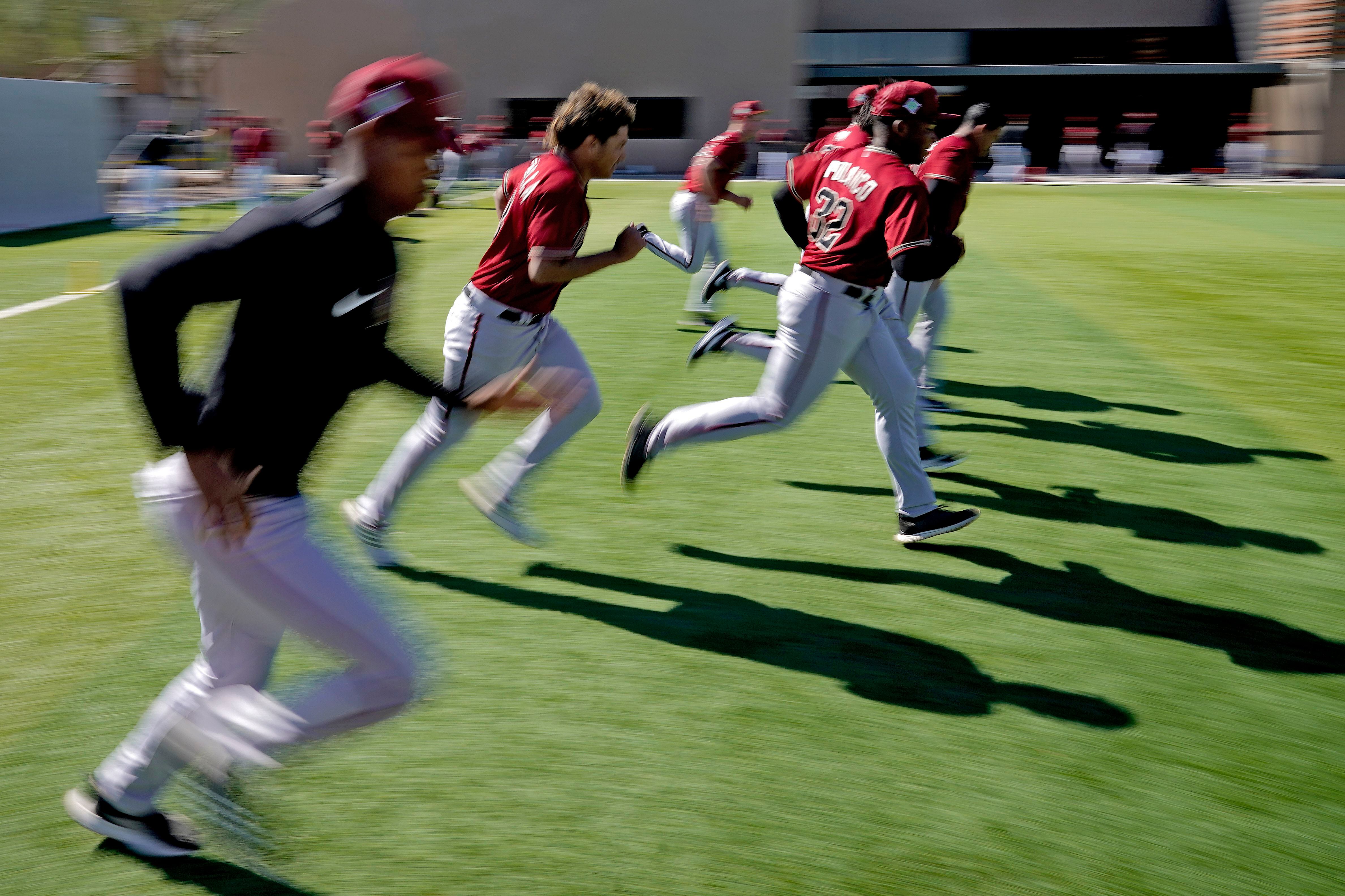 MLB spring camps open with Bieber sporting Guardians gear