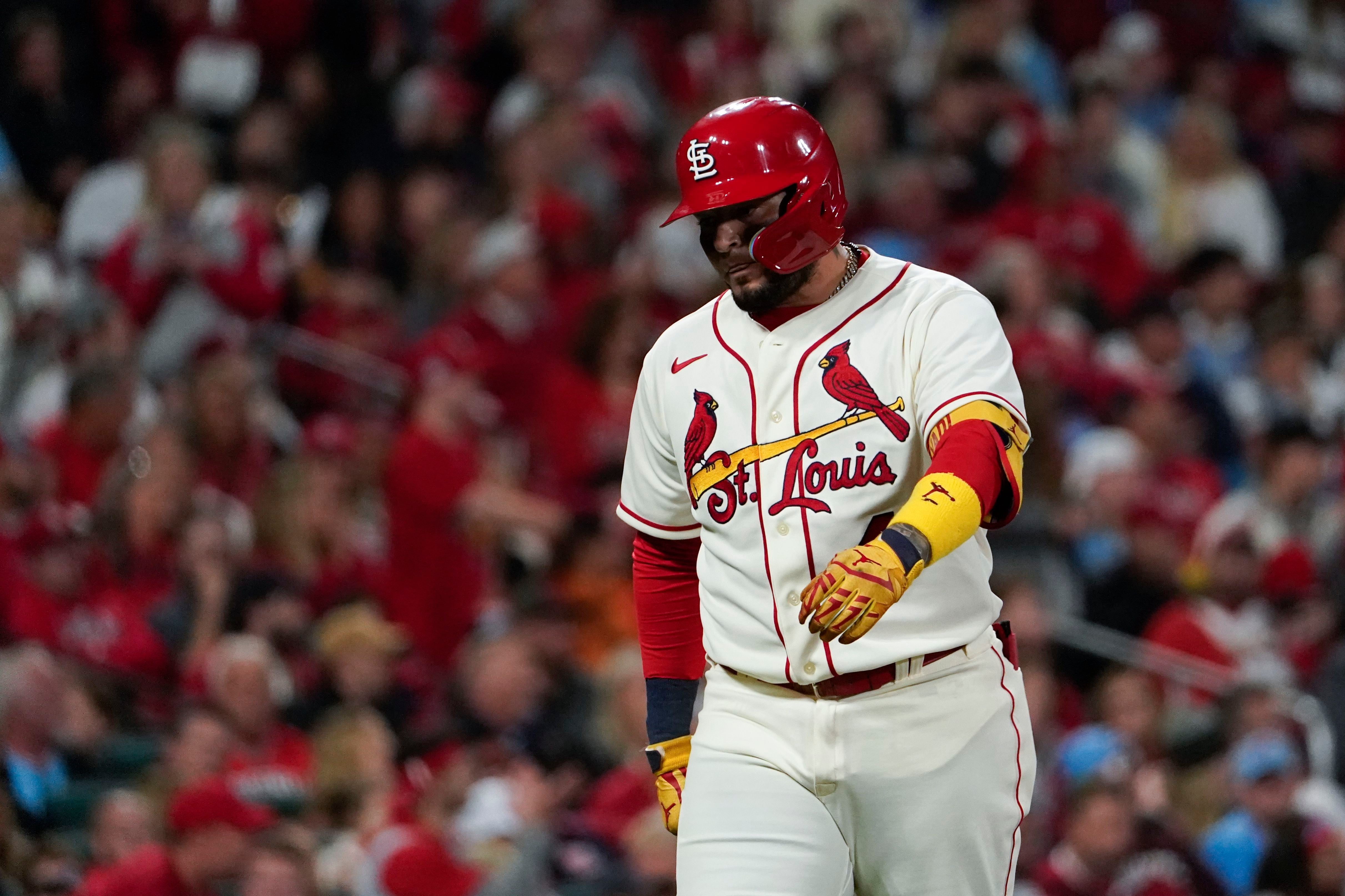 St. Louis Cardinals starter Miles Mikolas wipes his head and face