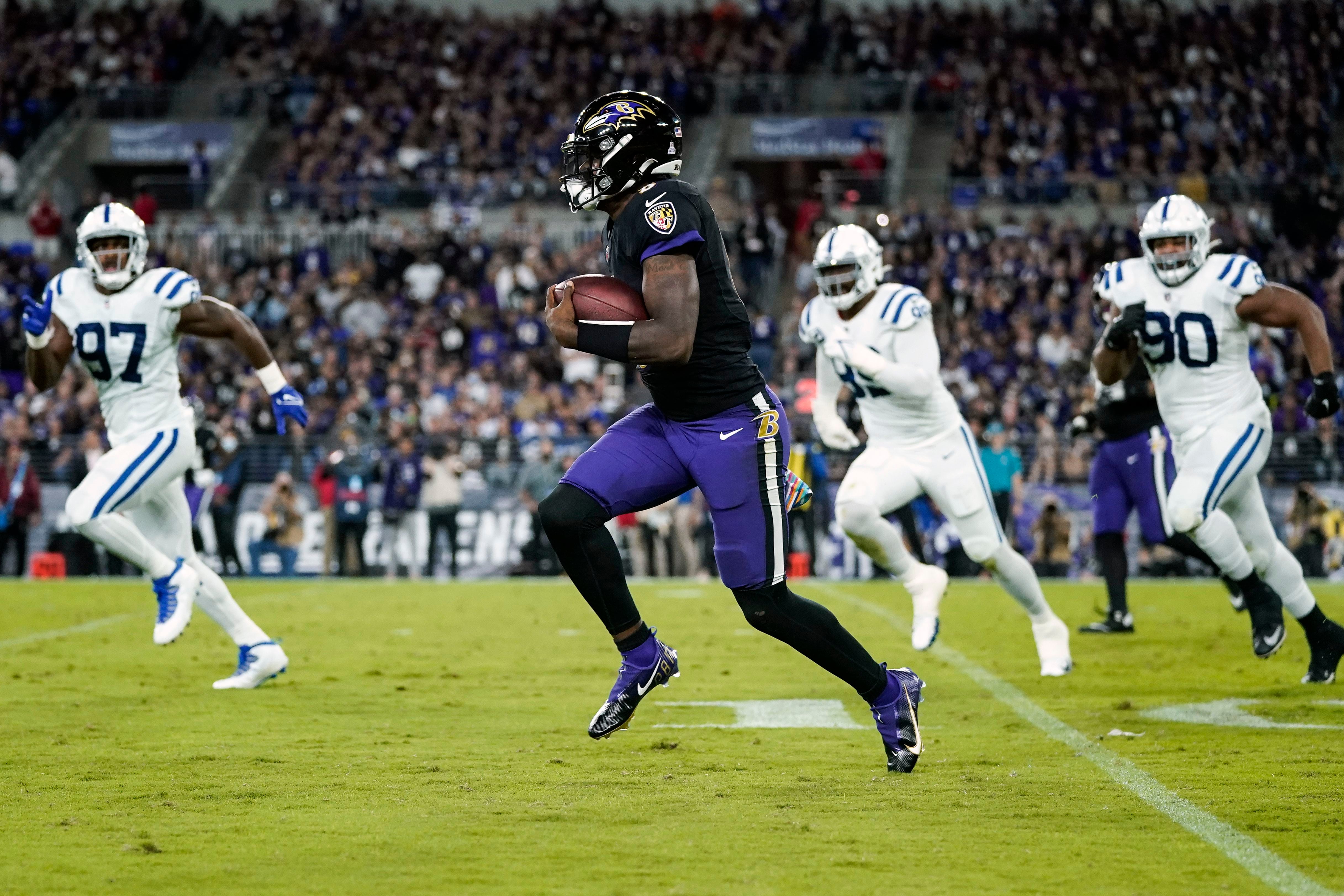 Lamar Jackson of the Baltimore Ravens scrambles against the Houston