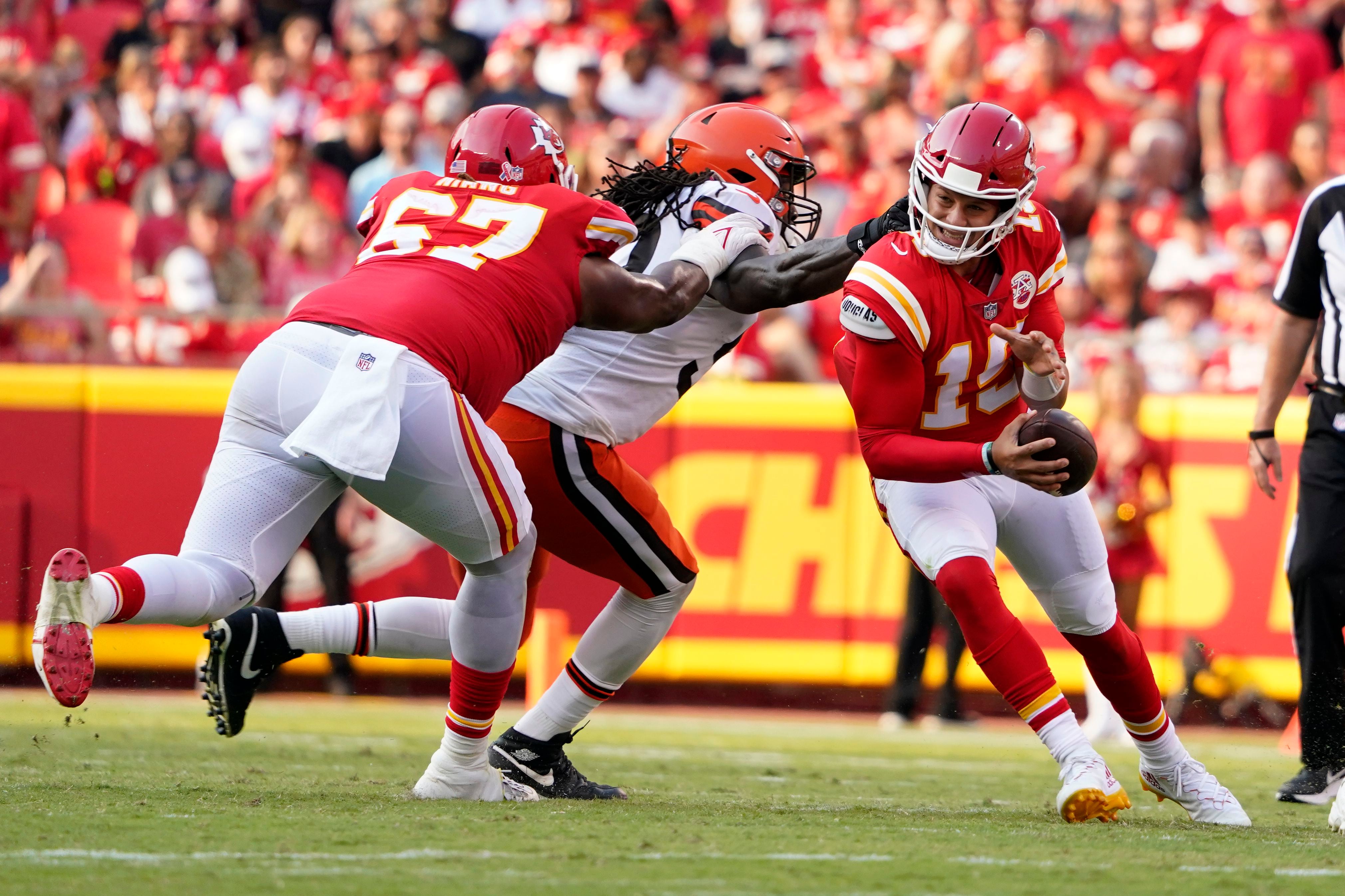 Kansas City Chiefs quarterback Patrick Mahomes (15) celebrates with tight  end Travis Kelce (87) after throwing a 67-yard touchdown pass to Tyreek  Hill during the first quarter of an NFL football game