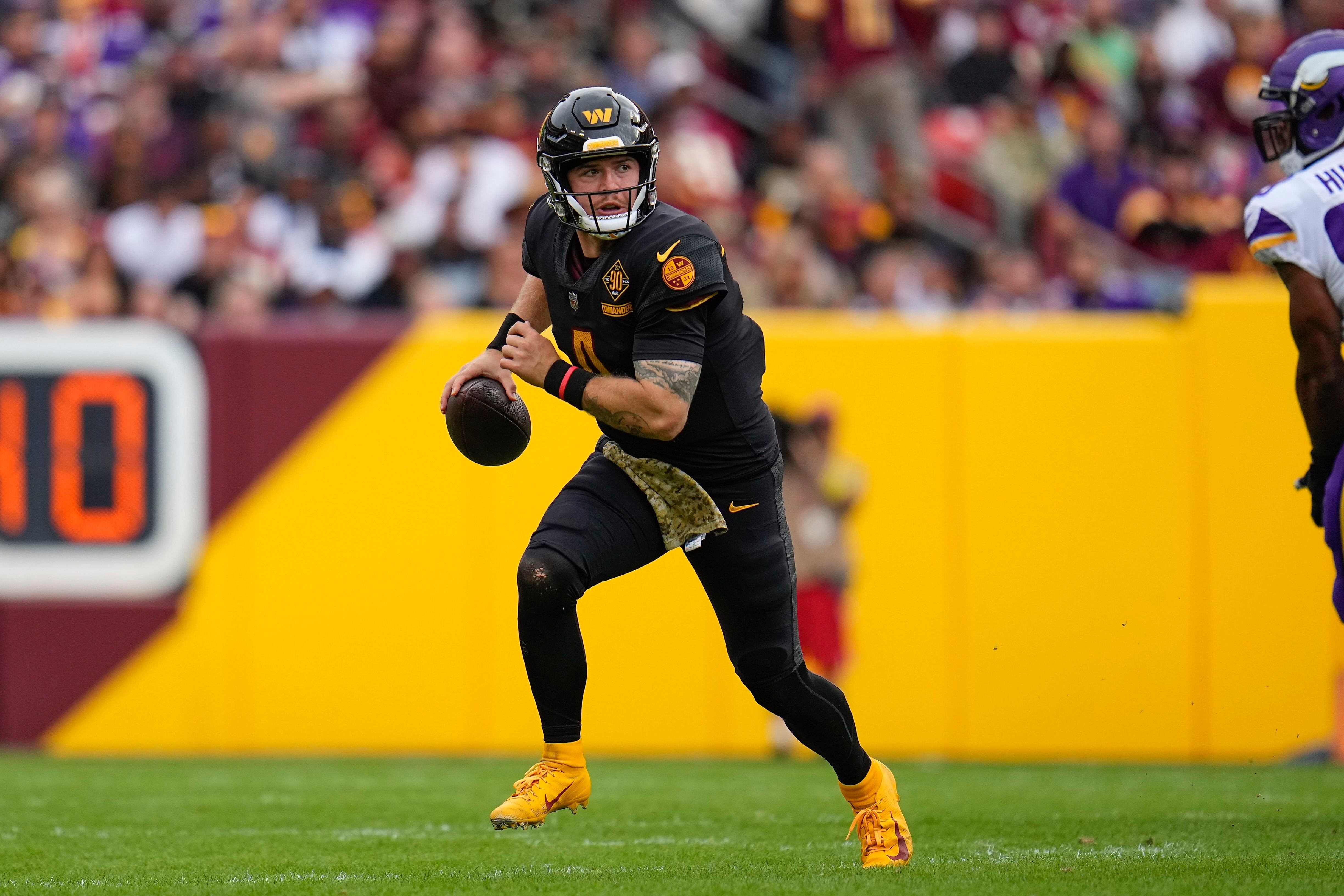 Washington Commanders safety Kamren Curl (31) runs during an NFL